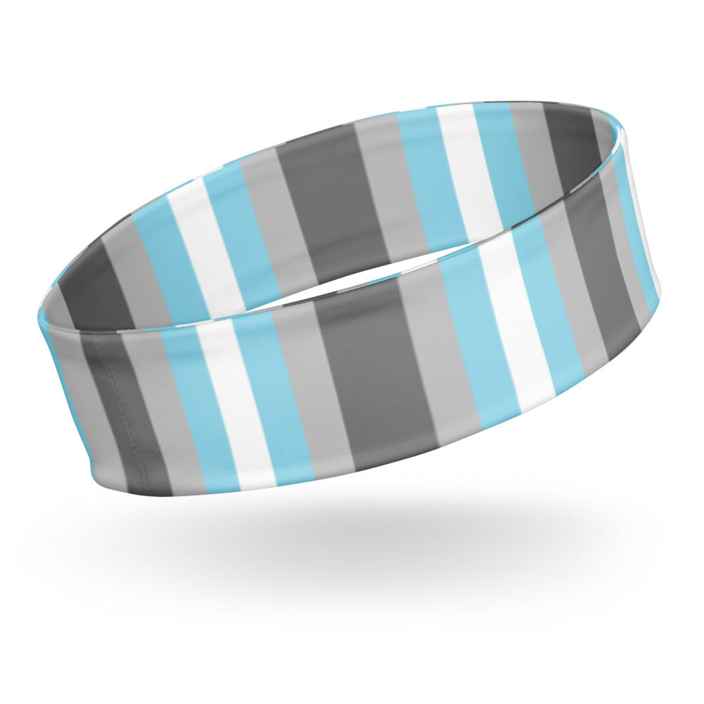 Wide fabric headband with vertical gray, black, white, and light blue stripes