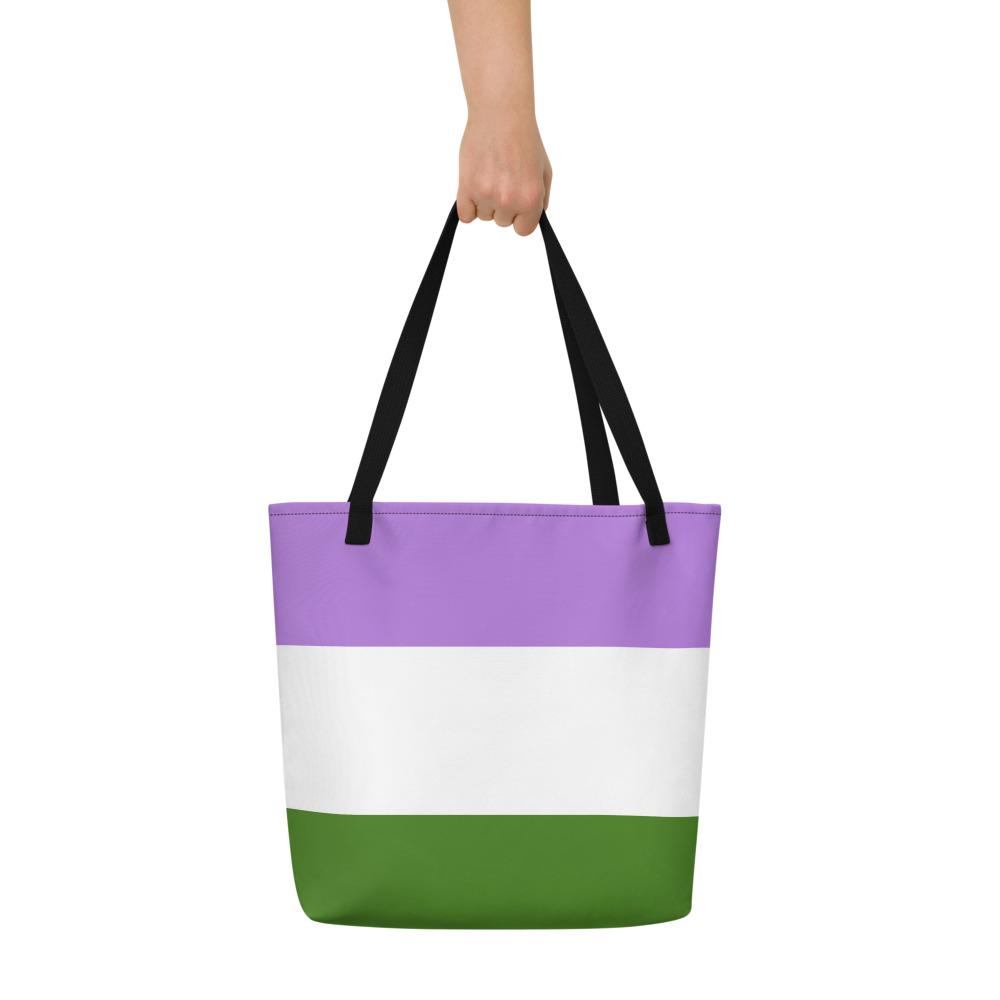 Purple, white, and green striped tote bag held by a hand