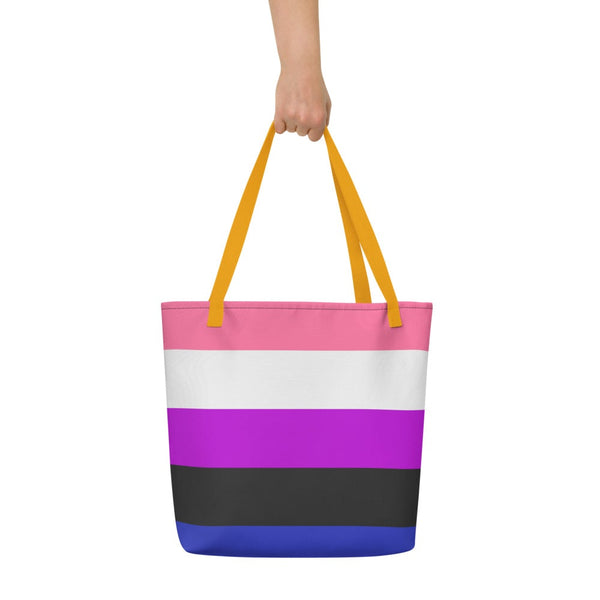Front-facing striped tote bag with pink, white, purple, black, and blue bands, held by yellow handles