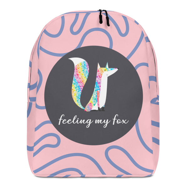 Front view of a pink backpack with blue squiggles, a rainbow fox, and “feeling my fox” text
