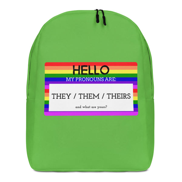 Front view of a green backpack with a rainbow pronoun panel reading “HELLO” and “THEY / THEM / THEIRS.”