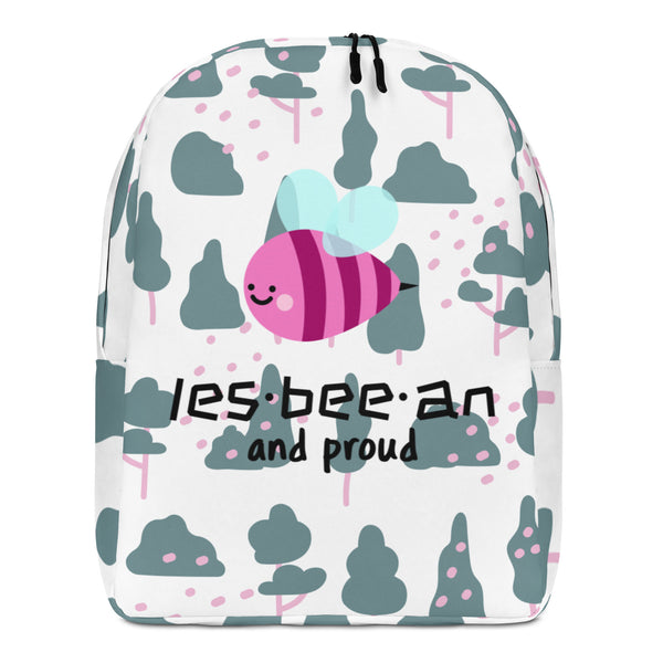 Front view of a white backpack with a smiling pink bee, trees, and “les-bee-an and proud” text