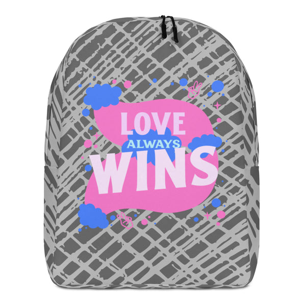 Front view of a gray patterned backpack reading “LOVE ALWAYS WINS” in pink and blue