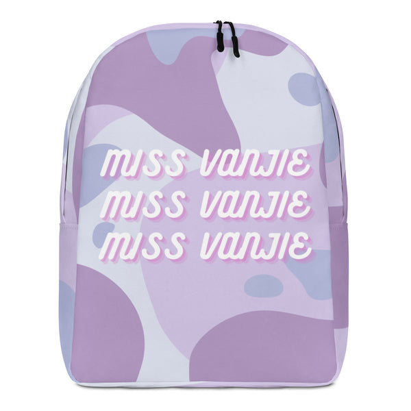 Front view of a lavender and white backpack reading “MISS VANJIE” three times