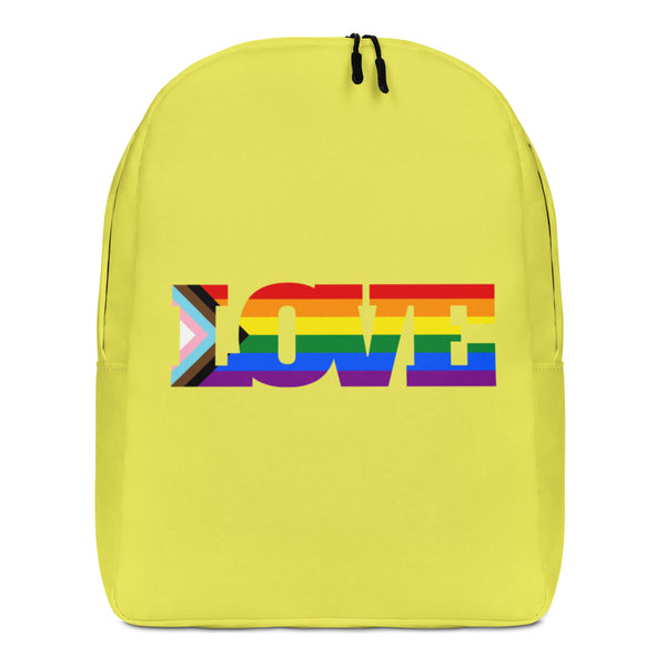 Front view of a yellow backpack with a rainbow-striped “LOVE” graphic and black zippers