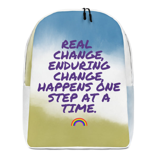 Front-facing minimalist backpack with purple text and a small rainbow on a blue, white, and yellow design