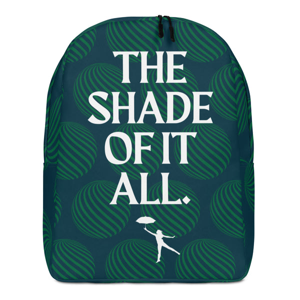 Front view of a dark teal backpack reading “THE SHADE OF IT ALL” in white