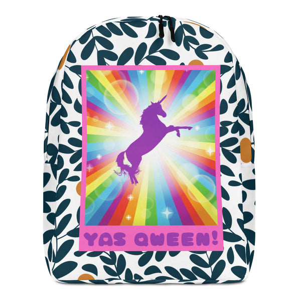 Front view of a white patterned backpack with a rainbow unicorn graphic and “YAS QWEEN!” text