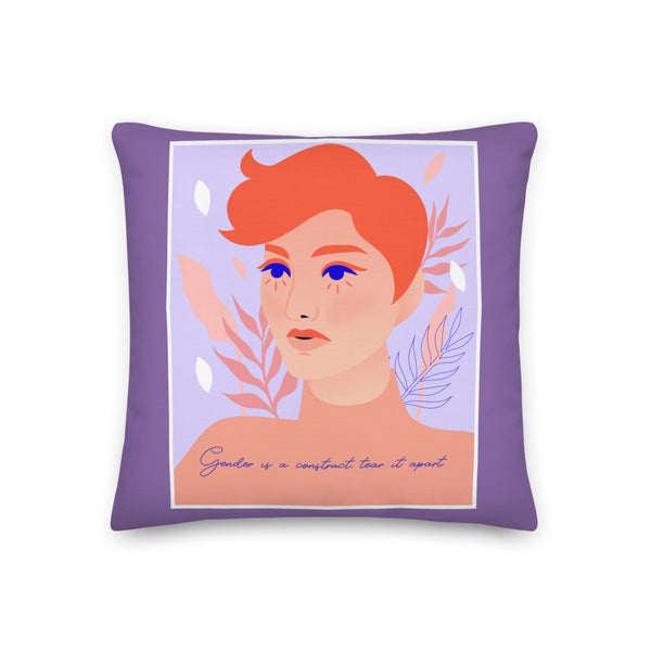 Purple pillow with a stylized red-haired portrait and “Gender is a construct tear it apart” slogan