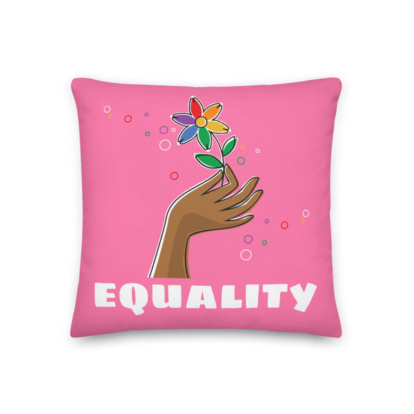 Pink equality pillow with a multicolored flower growing from an illustrated hand