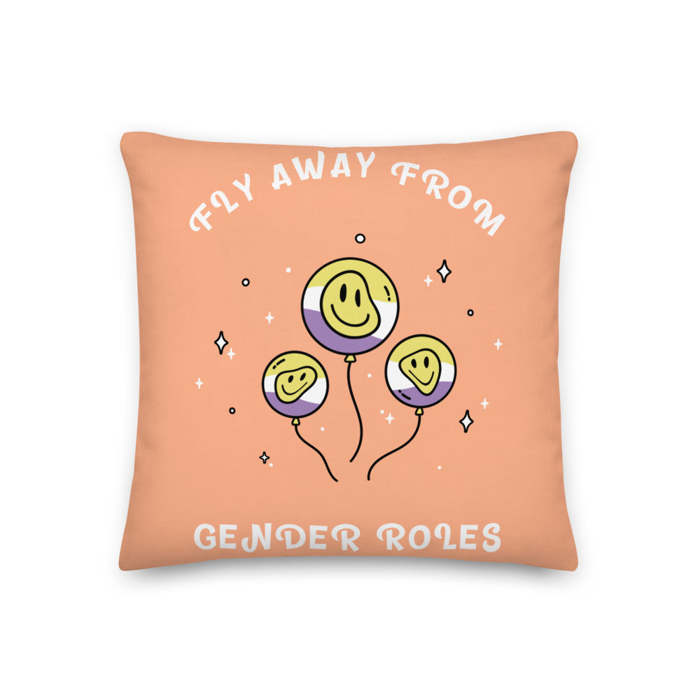 Peach square pillow with smiling gender-fluid flag balloons and “FLY AWAY FROM GENDER ROLES” text