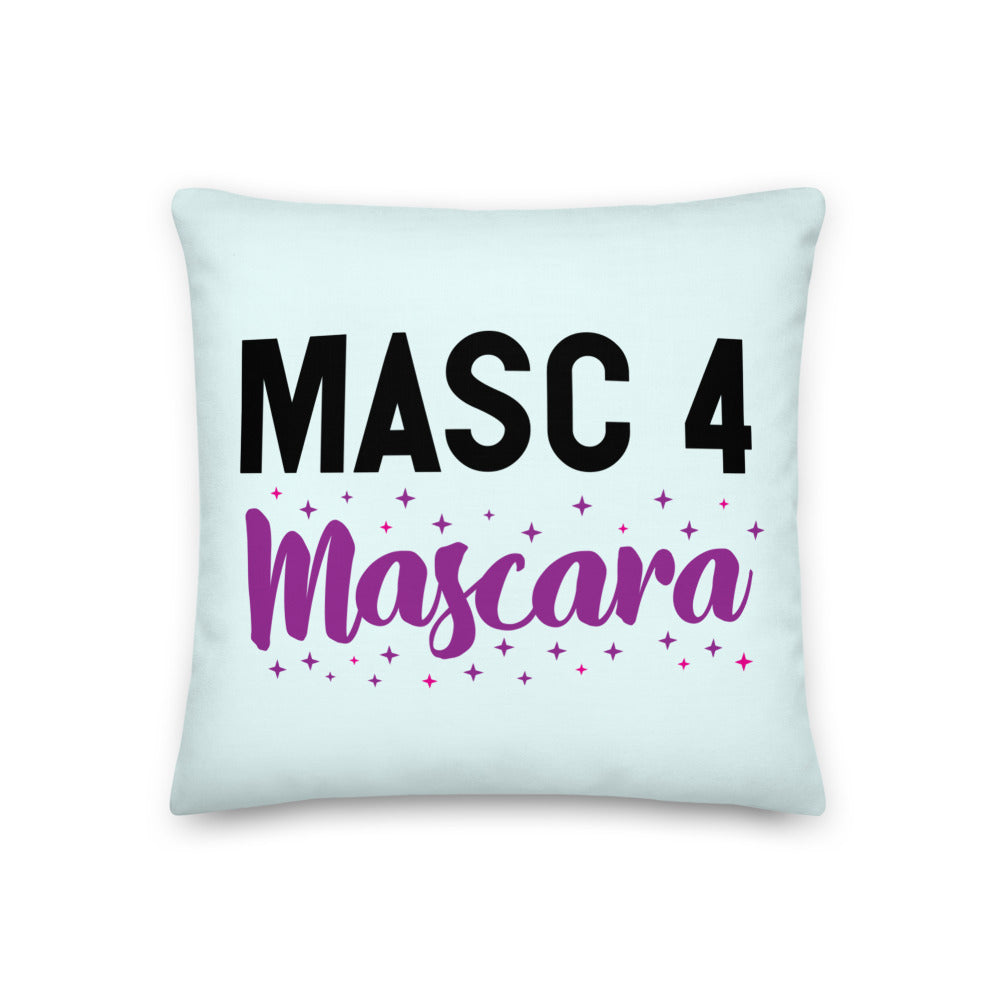 Light blue square pillow with “MASC 4 Mascara” lettering and purple-pink star accents