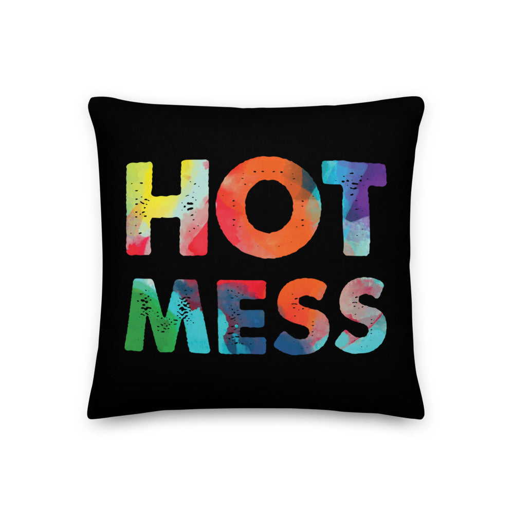 Black square pillow with colorful distressed lettering that reads “HOT MESS”