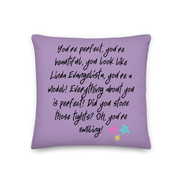 Lavender pillow printed with a black handwritten quote about Linda Evangelista and colorful stars