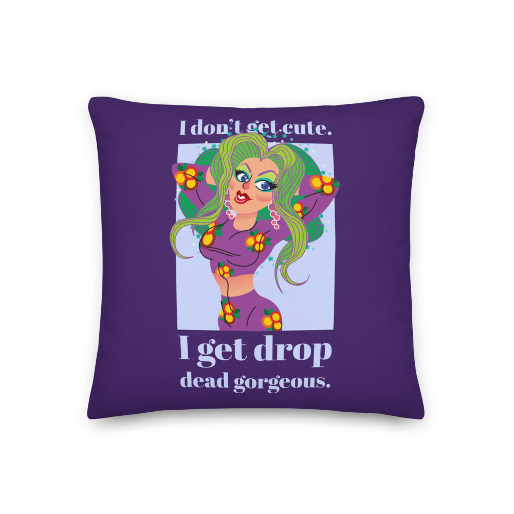 Purple pillow with a colorful illustrated figure and the words “I get drop dead gorgeous.”