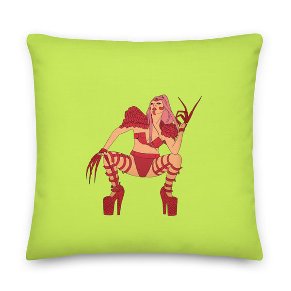 Lime green square pillow featuring an illustrated pink-haired woman in red lingerie and high heels
