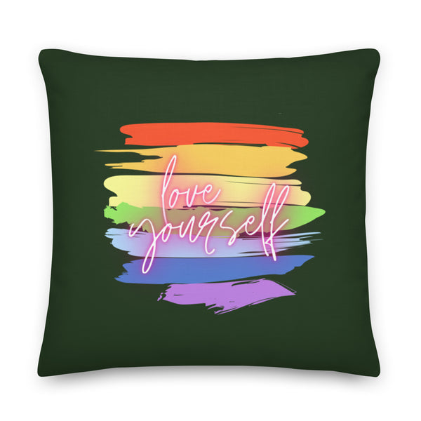 Square dark green pillow with colorful brushstrokes and neon script reading “love yourself”