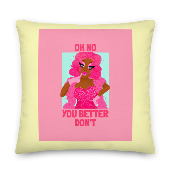 Square pale-yellow pillow with pink graphic, drag-style figure, and “OH NO YOU BETTER DON'T” text