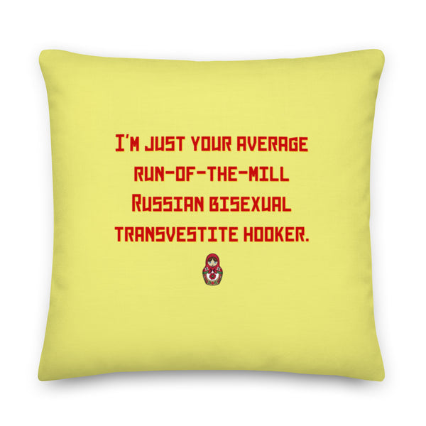 Yellow square pillow with red text reading “I’M JUST YOUR AVERAGE RUN-OF-THE-MILL RUSSIAN BISEXUAL TRANSVESTITE HOOKER.”