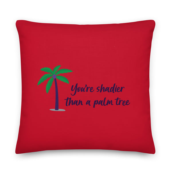 Red square pillow with a palm tree and the text “You’re shadier than a palm tree.”