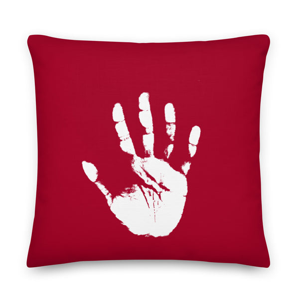 Front view of a red square pillow with a distressed white raised handprint graphic