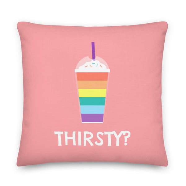 Pink square pillow with a rainbow-striped drink graphic and “THIRSTY?” text