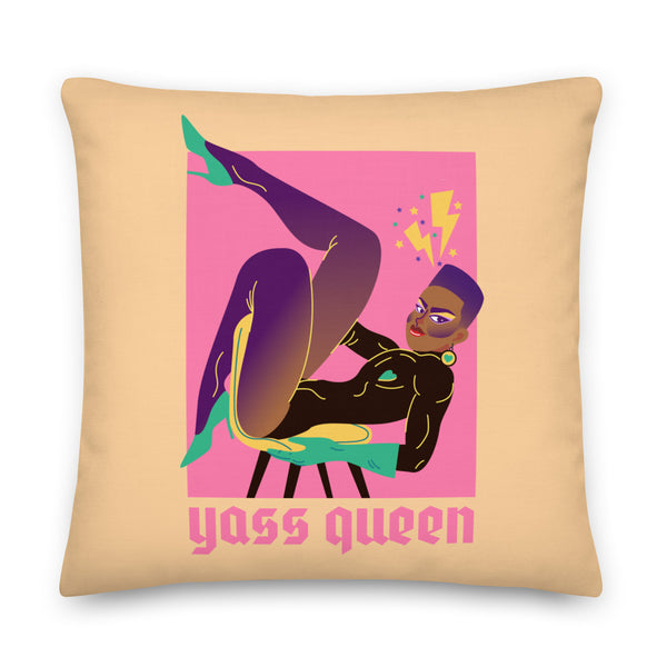 Square tan pillow with a colorful stylized reclining woman and “Yass Queen” text