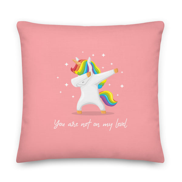 Pink square pillow with a rainbow-maned unicorn and the words “You are not on my level.”