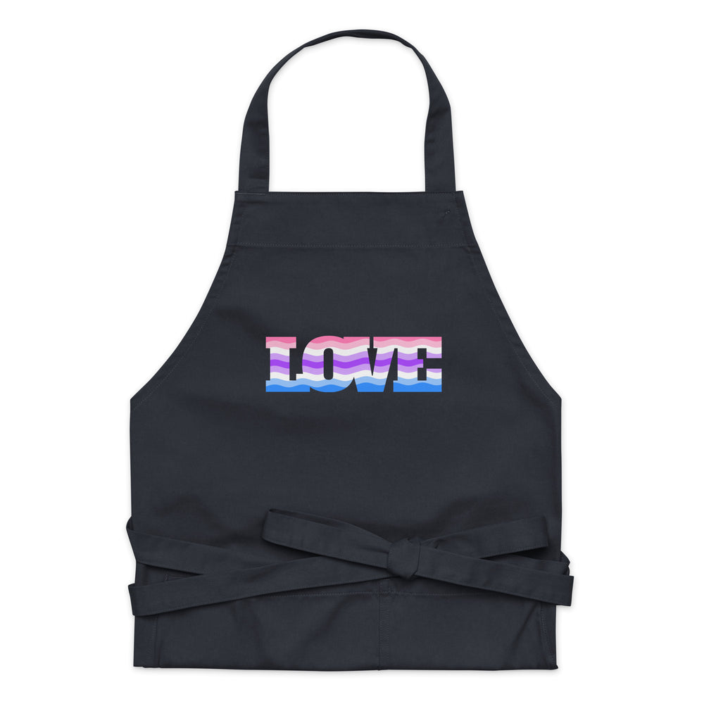 Front view of a black apron with a colorful genderfluid flag and “LOVE” lettering