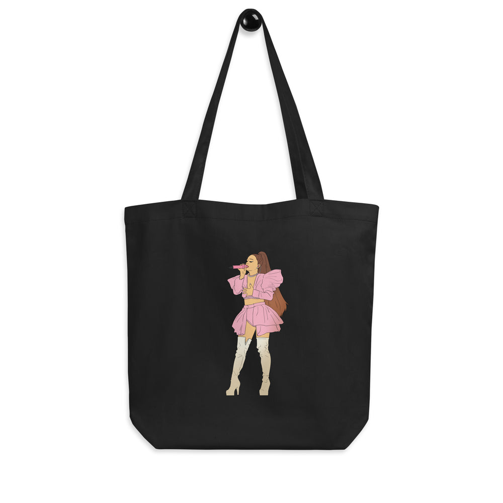 Front-view black tote bag with long handles and a pink singer illustration