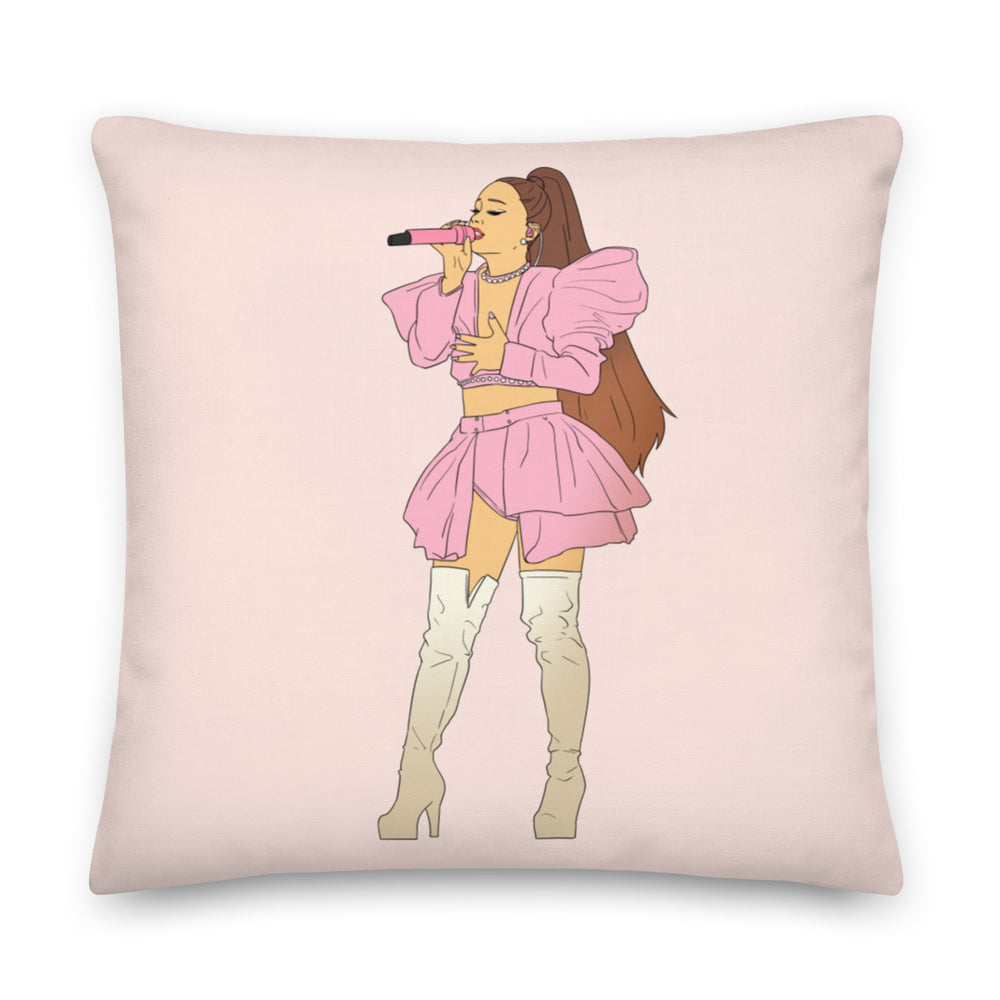 Square pale pink pillow with an illustrated singer in a pink outfit holding a microphone