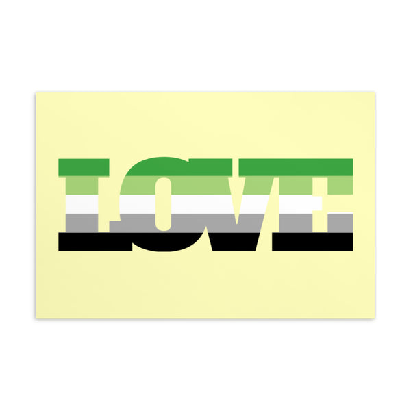 A pale yellow postcard with large block letters spelling “TONE” in green, gray, and black stripes