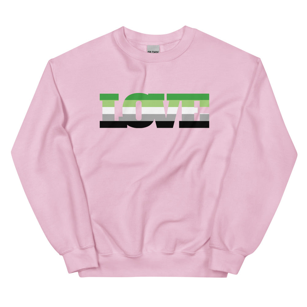 Front view of a pink sweatshirt with a green, white, gray, and black geometric chest graphic