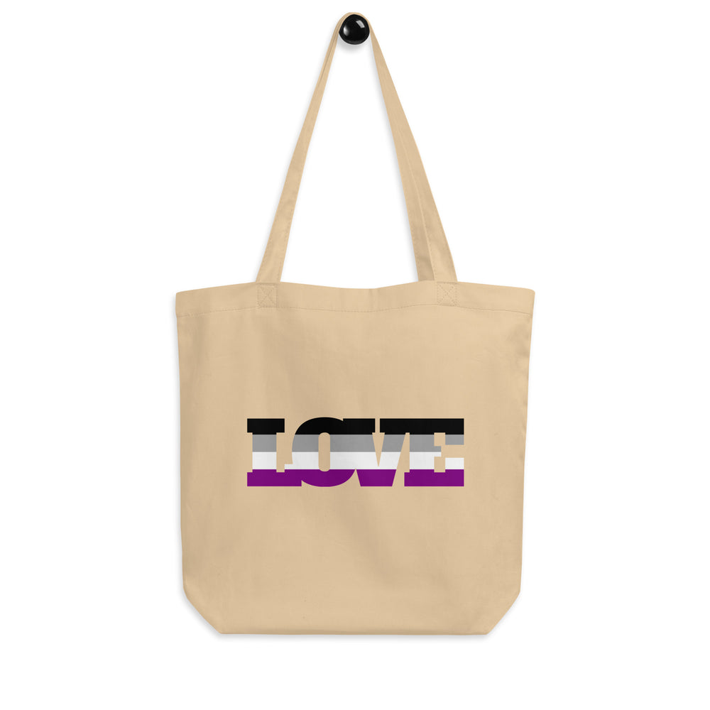 Natural canvas tote bag with black, gray, white, and purple stripes spelling “LOVE”