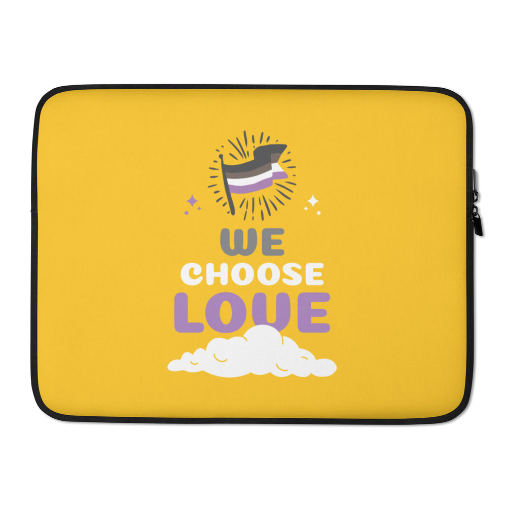 Front view of a yellow laptop sleeve with an asexual flag and “WE CHOOSE LOVE” lettering