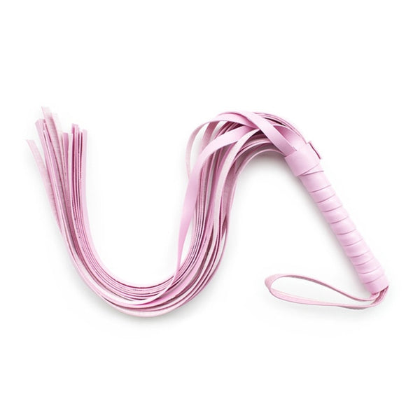 Close-up of a pink multi-tail BDSM fetish whip with wrapped handle and wrist loop