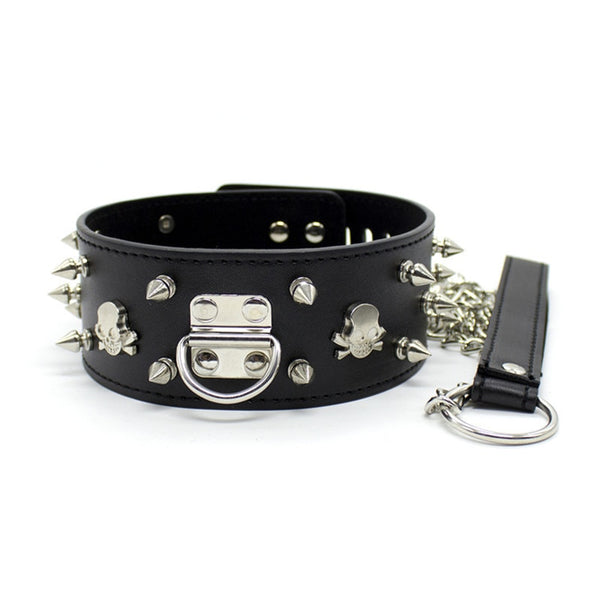 Black studded BDSM collar with skull accents, O-ring clasp, chain, and matching lead