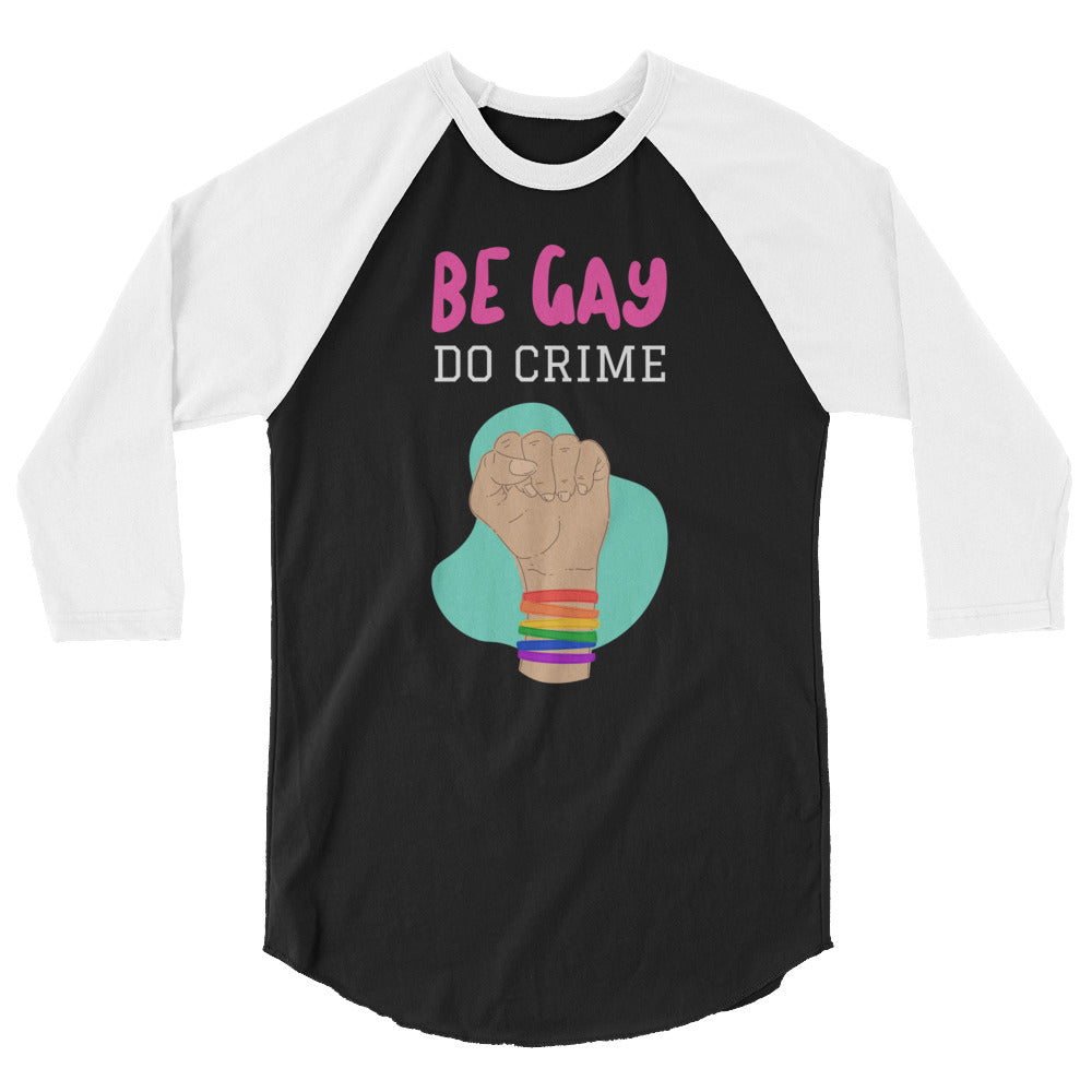 Front view of a black-and-white raglan shirt reading “BE GAY DO CRIME” with a raised fist