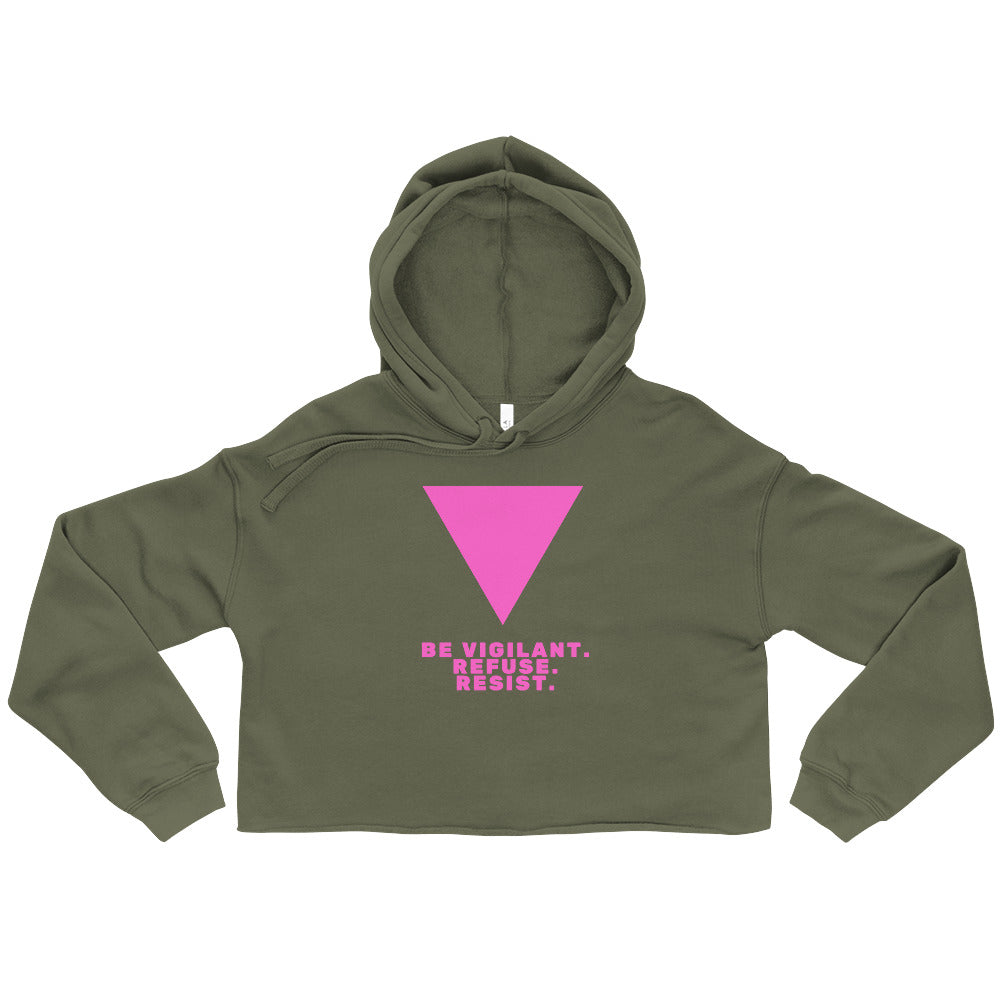 Front view of an olive-green cropped hoodie with a pink inverted triangle and slogan text.
