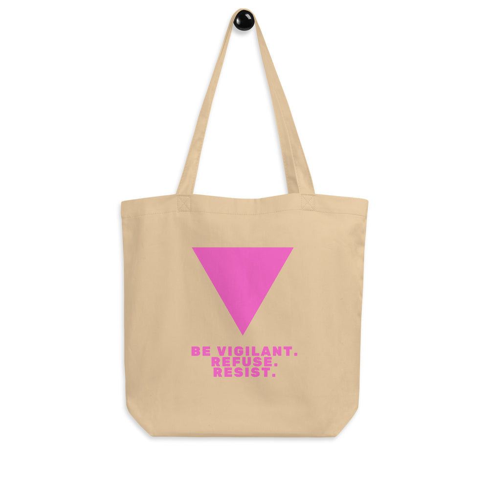 Beige tote bag with a pink inverted triangle and “BE VIGILANT. REFUSE. RESIST.” text