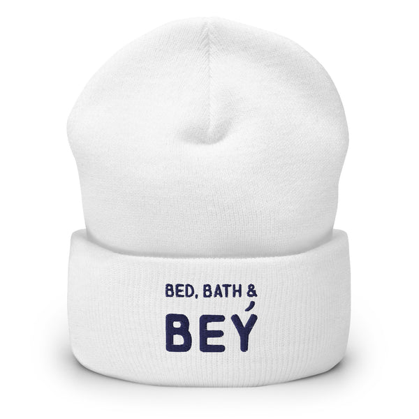 Front view of a white cuffed beanie reading “BED, BATH & BEY” in navy lettering