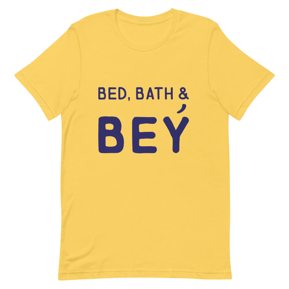 Yellow T-shirt with navy lettering reading “BED, BATH & BEY”