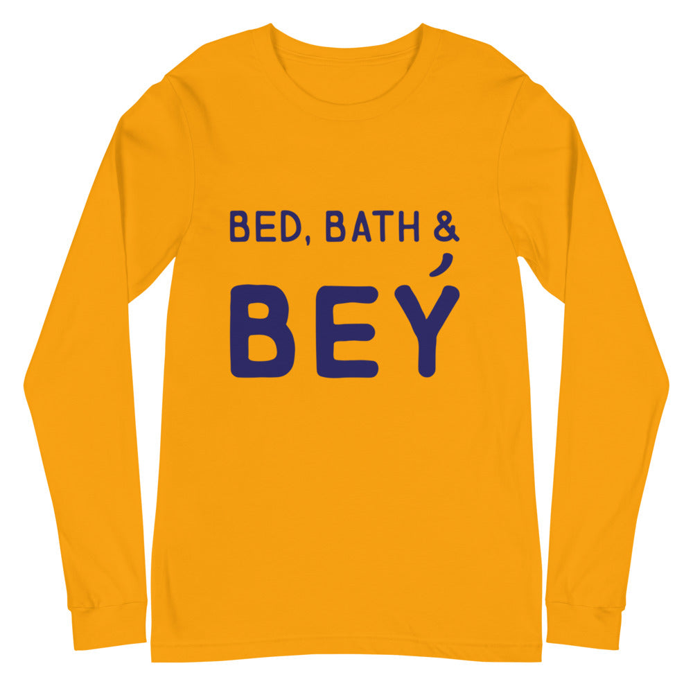 Front view of a golden-yellow long-sleeve shirt reading “BED, BATH & BEY” in navy