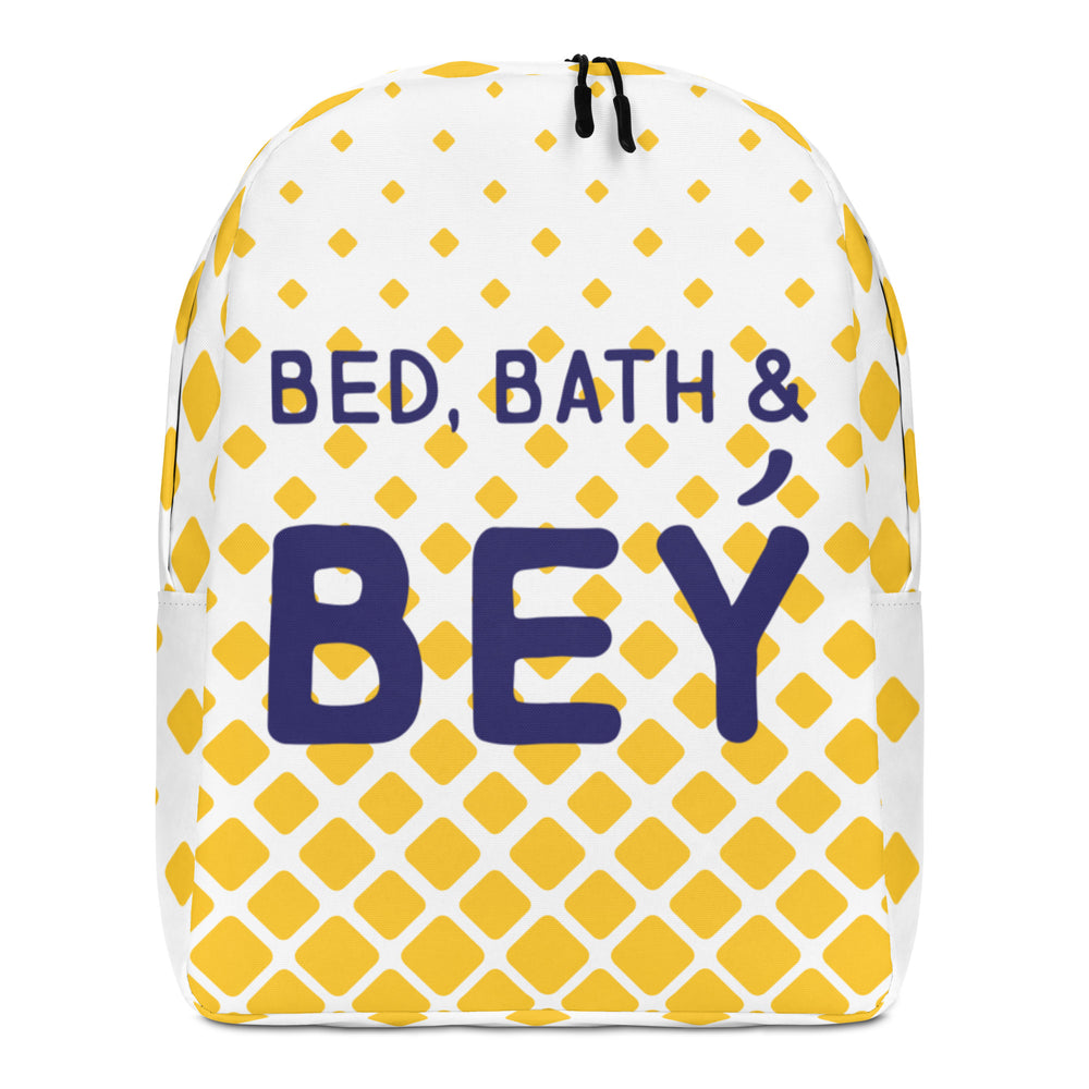 Front view of a white backpack with yellow diamonds and purple “BED, BATH & BEY” text
