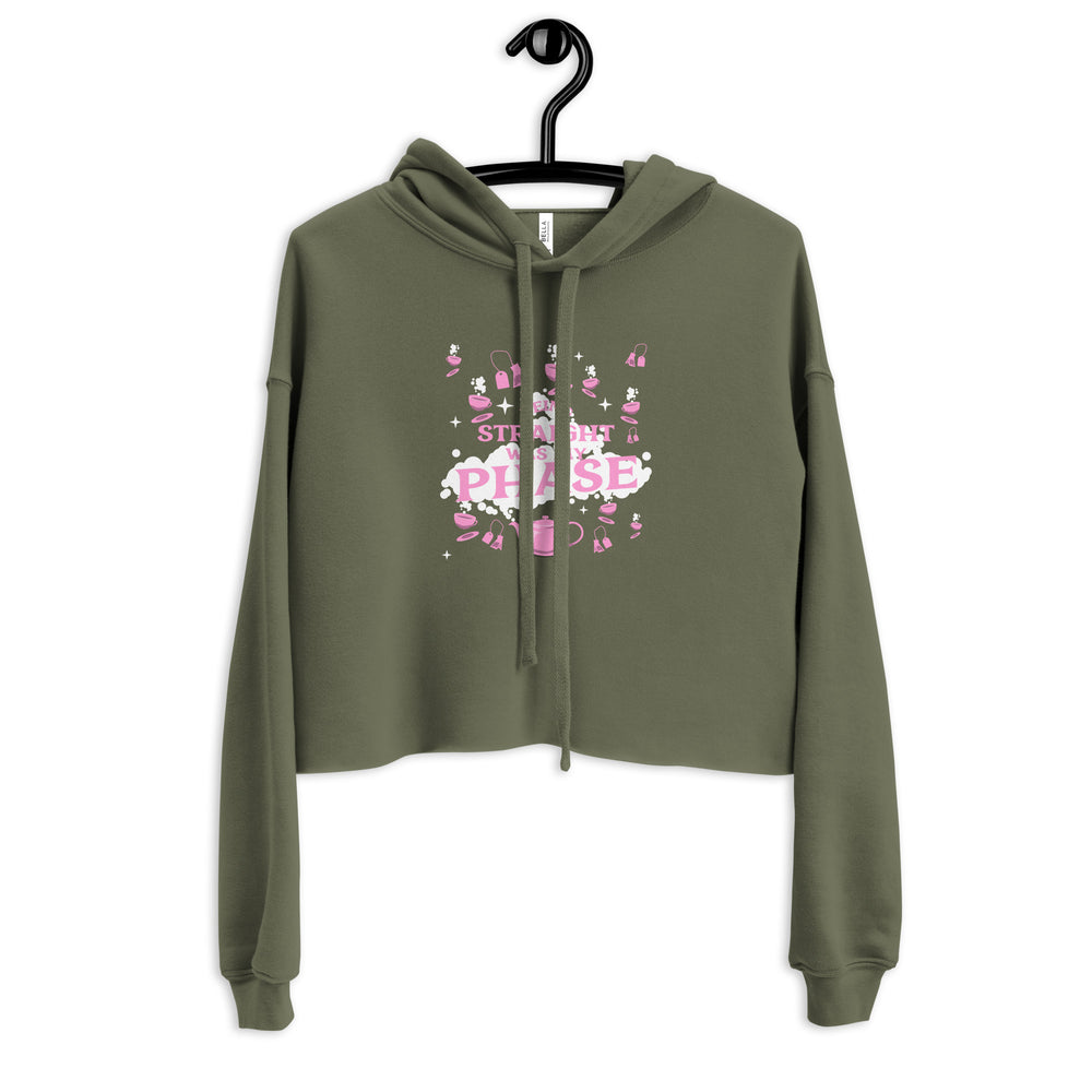 Front view of an olive-green cropped hoodie with pink “BEING STRAIGHT WAS MY PHASE” graphic