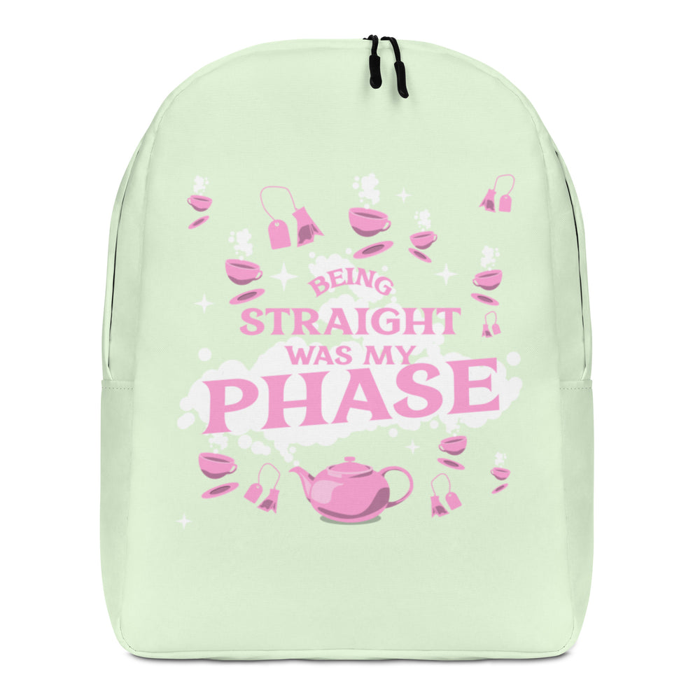 Front-facing pale green backpack reading “BEING STRAIGHT WAS MY PHASE,” with pink teaware