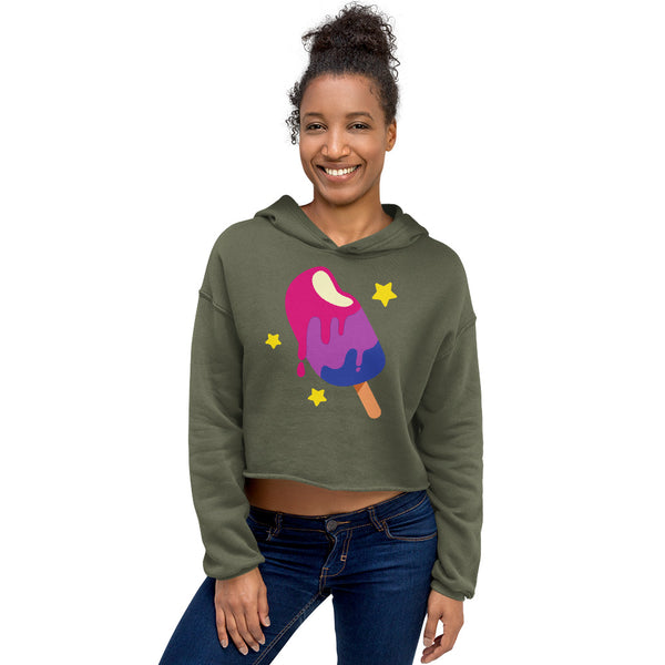 Model wearing a cropped olive-green hoodie with a colorful melting popsicle graphic