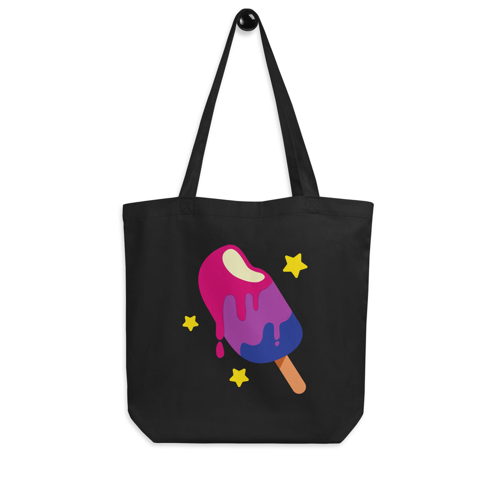 Front-facing black tote bag with a pink, purple, and blue melting popsicle and yellow stars
