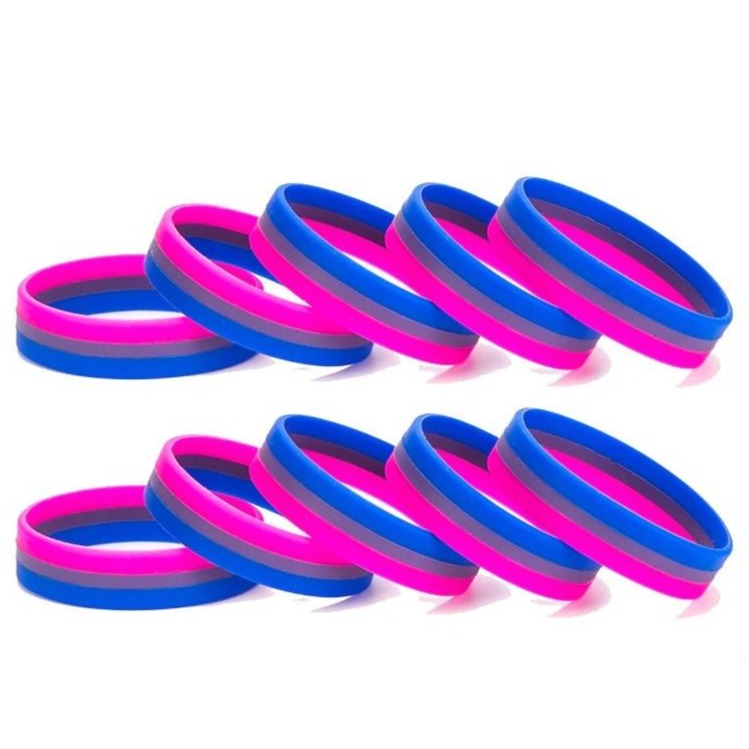 Close-up of pink, purple, and blue bisexual Pride rubber wristbands arranged in two rows