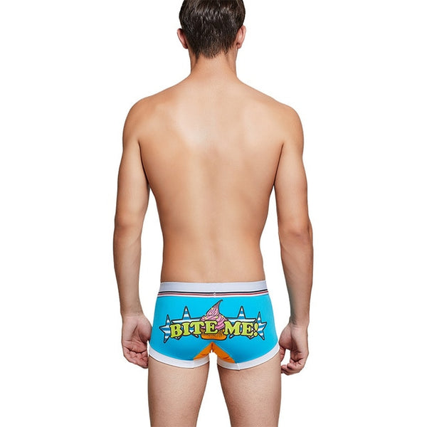 Rear view of blue boxers with a colorful shark graphic and clear “BITE ME” lettering